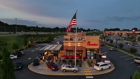 Chick-Fil-A-drive-through-and-American-flag-at-night