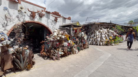 Nogales,-Mexico-street-vendors-and-shops-sell-cow-skulls-and-other-traditional-Mexican-and-latin-products