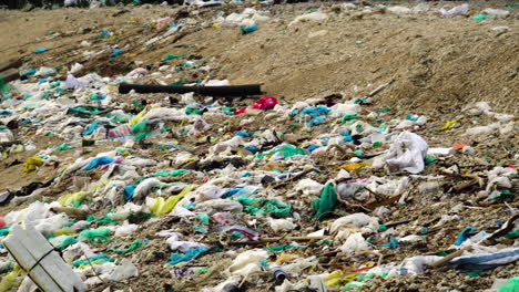 Close-up-pan-left-shot-of-garbage-scattered-on-Vietnamese-beach