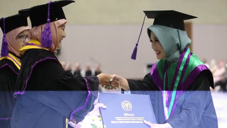 A-mature-university-dean-congratulating-a-young-student-on-his-graduation