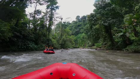 POV-On-Red-Rafting-Boat-Following-Another-Going-Along-Ayung-River-In-Ubud