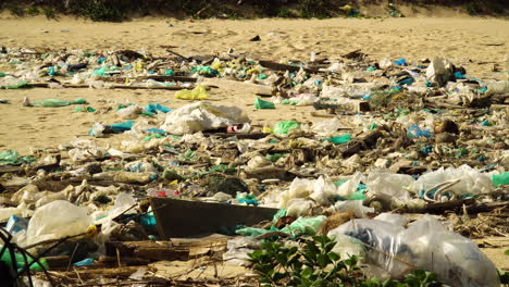 Close-up-of-a-very-polluted-beach-full-with-garbage-in-the-touristic-island