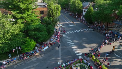 Crowds-gather-in-town-square-to-watch-July-4-Independence-Day-holiday-parade