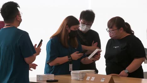 Clients-are-seen-testing-and-purchasing-Apple-brand-products-during-the-release-launch-day-of-the-new-iPhone-14-series-smartphones-in-Hong-Kong