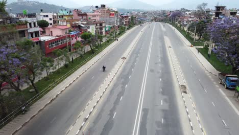 An-aerial-flight-over-the-empty-ring-road-in-the-city-of-Kathmandu,-Nepal
