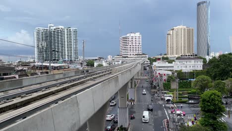 Skytrain-elevated-tracks-against-Bangkok-skyline-as-seen-from-Charoen-Nakhon-station
