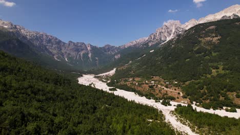 Paradise-mountain-valley-in-remote-area-of-Alps-in-Albania,-surrounded-by-high-peaks