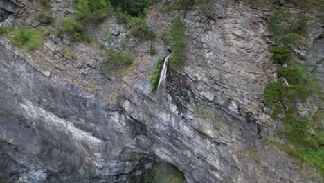 Waterfall-on-mountains-of-Alps-in-Albania-with-reduced-water-on-heat-summer-season