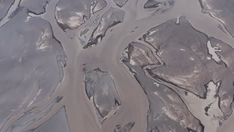 Glacial-melt-water-river-in-Iceland-mixed-with-natural-minerals,-aerial