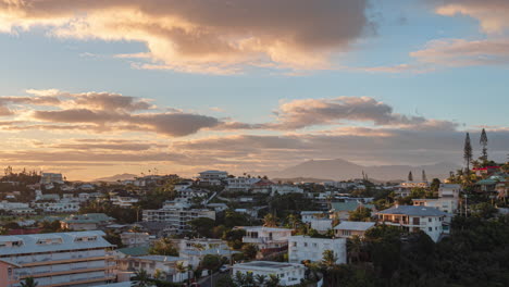 Colorful-sunset-and-cloudscape-over-the-Oceania-city-of-Noumea,-New-Caledonia---Day-to-night-time-lapse