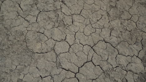 Dried-Lifeless-Parched-Barren-Clay-Ground,-High-Angle-POV