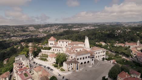 Residence-town-palace-on-Sintra-hills-against-spectacular-beautiful-landscape,-aerial-pull-out-shot