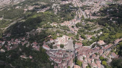 The-Palace-of-Sintra-surrounded-by-picturesque-houses-and-Natural-Park-forest