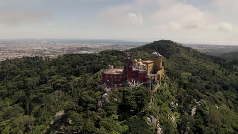 Pena-Palace,-hilltop-castle-surrounded-by-lush-forest-in-Sintra,-Lisbon,-Portugal