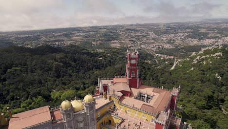 Aerial-circular-pan-shot-around-the-decorative-clock-tower-of-Pena-palace-in-Sintra-Portugal