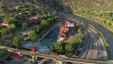Aerial-view-of-the-people-bridge-and-hot-springs-pool,-in-Glenwood-Springs,-Colorado