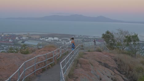 Lady-Wearing-Blue-Dress-On-Hilltop-Viewpoint-At-Castle-Hill-Lookout-In-Townsville,-Queensland,-Australia