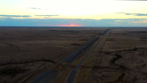 Aerial-View-Of-The-Vacant-Road-At-The-Middle-Of-The-Vast-Land-In-Rural-Area-Of-Queensland-In-Australia