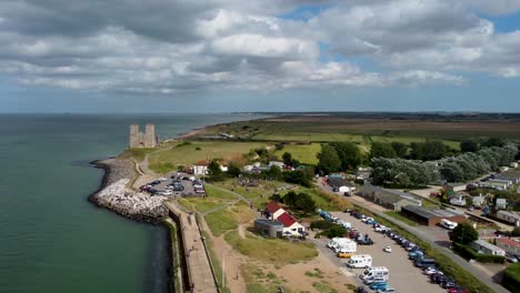 A-high-and-wide-drone-shot-of-the-stunning-historical-Reculver-Towers-in-Kent,-England
