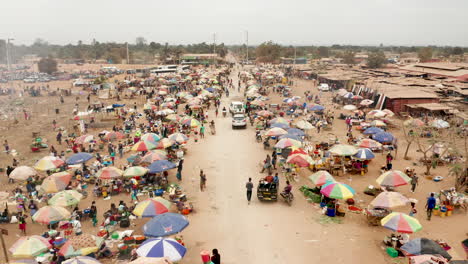 Traveling-front-over-the-informal-market,-Caxito-in-Angola,-Africa-2