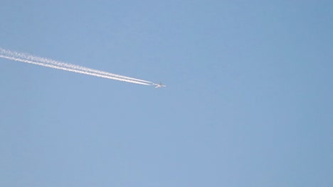 Airplane-in-clear-blue-sky-from-the-ground