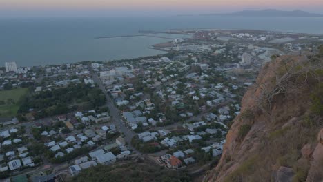 Scenic-View-At-The-Castle-Hill-Lookout-At-Townsville-To-The-Cliff,-Town,-Coastline-And-Magnetic-Island---handheld-shot