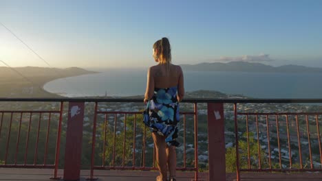 Woman-In-Floral-Tube-Dress-At-Viewing-Platform-Of-Castle-Hill-Lookout-In-Townsville,-Queensland,-Australia