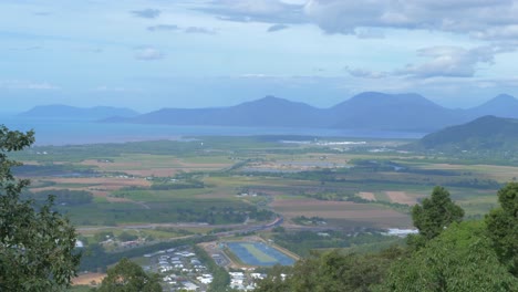View-Of-Vast-Landscape-In-Mist-With-Mountains-In-Background-In-Cairns-Region,-QLD,-Australia