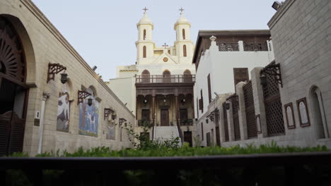 Dolly-shot-moving-back-through-courtyard-of-Hanging-Church-Cairo-Egypt