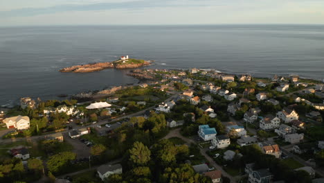 Wide-Aerial-Shot-of-Cape-Neddick-and-Nubble-Lighthouse-in-Maine-at-Sunset