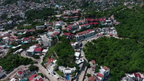 Ultra-wide-angle-pan-reveal-shot-of-Acapulco-city-in-Mexico-at-day