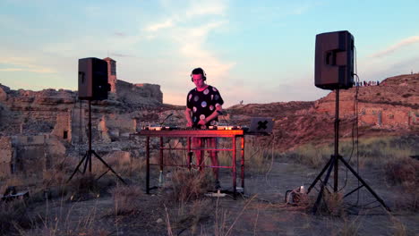 Disc-Jockey-Playing-and-Mixing-Records-In-the-Sunset