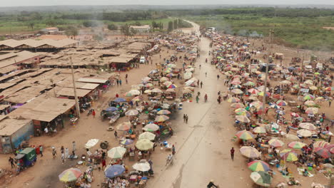 traveling-left-over-the-informal-market,-Caxito-in-Angola,-Africa