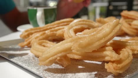 Traditional-Spanish-Sweet-Pastry-Churros-Served-On-A-Sunny-Morning-Breakfast