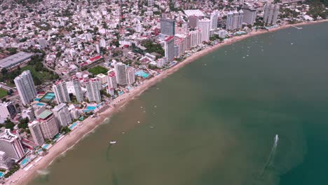 Birds-eye-view-above-beautiful-condesa-beach-coast-in-Mexico,-wide-angle
