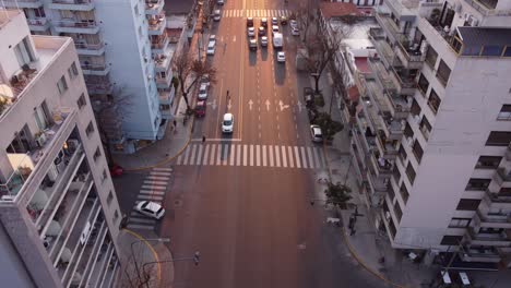 AERIAL---Large-avenue-at-sunrise-in-Palermo,-Buenos-Aires,-Argentina,-descending