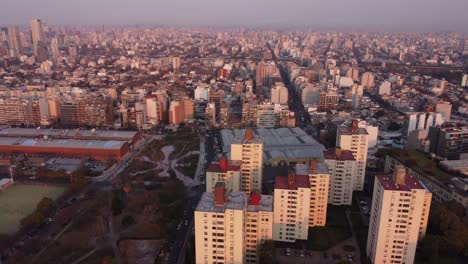 Aerial-view-of-group-of-tall-modern-office-and-residential-buildings-during-sunset-in-buenos-aires,-Argentina