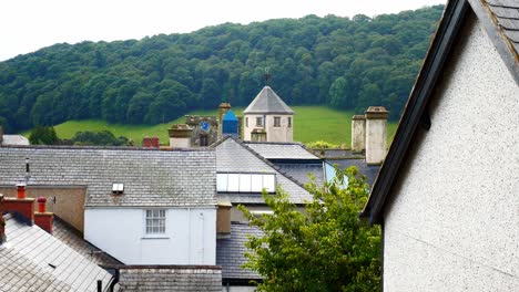 Old-watch-tower-building-between-medieval-castle-walls-above-small-town-Conwy-rooftops