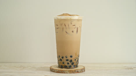 Taiwan-milk-tea-with-bubble-and-cheese-burned-on-wood-table
