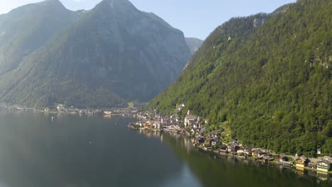 Village-of-Hallstatt,-Austria-in-the-Distance,-Descending-Aerial-Shot