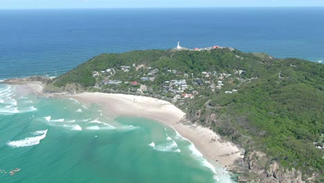 Aerial-drone-view-of-Byron-Bay-surrounded-by-blue-water-day-including-the-Byron-Bay-Lighthouse