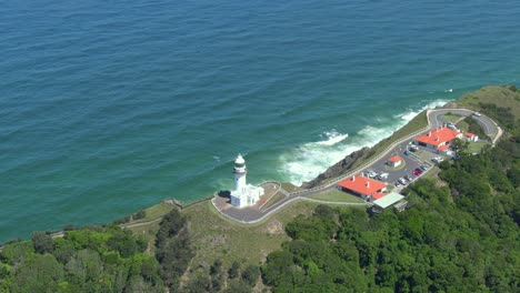 Orbiting-aerial-shot-of-famous-Cape-Byron-Lighthouse-on-Australia's-northern-coast,-New-South-Wales,-Australia