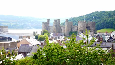 Conwy-castle-waterfront-landmark-views-above-breezy-riverside-leafy-tree-foliage
