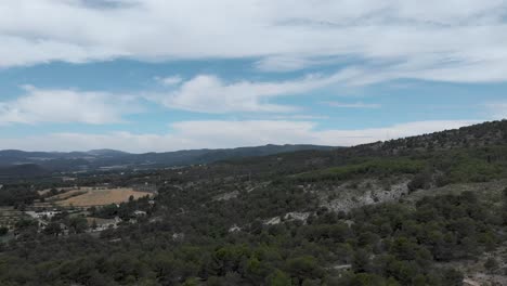 Village-on-the-woody-mountainside-of-Alcoi,Valencia,Spain,drone-shot
