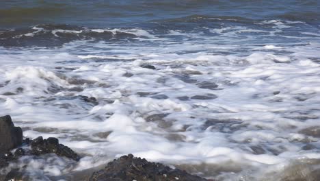 close-up-of-waves-on-the-beach-during-the-day