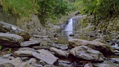 Freshwater-Flows-From-Rocky-Hills-At-Crystal-Cascades-Near-Cairns-In-Redlynch,-Queensland,-Australia