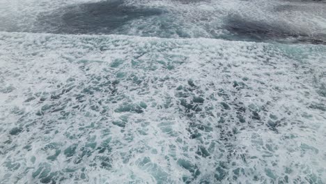 Aerial-flight-over-ocean-waves-crashing-and-ocean-wash