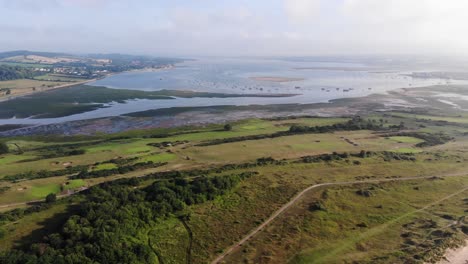 Aerial-Pan-Right-View-Of-Dawlish-Golf-Course-And-Mouth-Of-River-Exe
