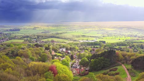 Dramatic-rain-clouds-form-over-Clent-Hills-and-the-beautiful-rural-Midlands-in-England-making-for-stunning-rural-scenery