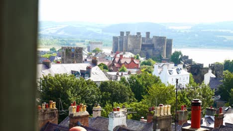 Medieval-Conwy-castle-tiled-Victorian-house-roof-chimneys-urban-property